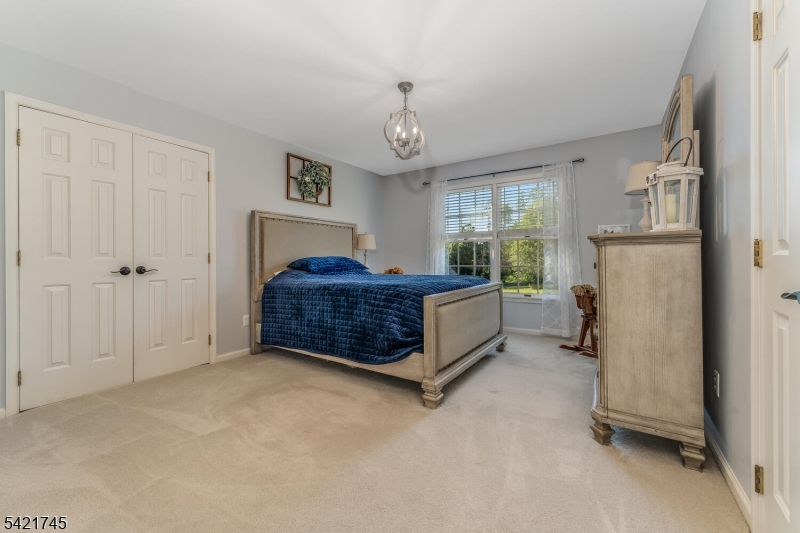 93 Bissell Road Lebanon, NJ 08833 - Photo 30 of 31 a spacious bedroom with a bed and a window