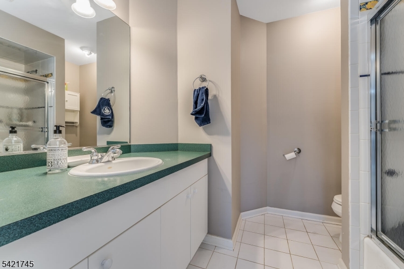 93 Bissell Road Lebanon, NJ 08833 - Photo 31 of 31 a bathroom with a granite countertop sink and a mirror