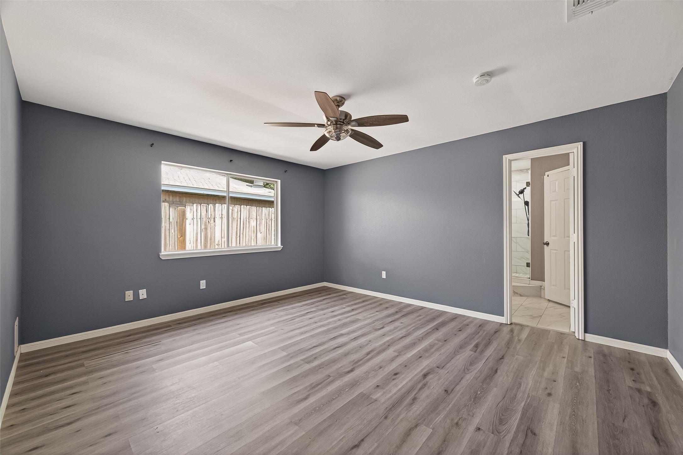 24006 Lone Elm Drive Spring, TX 77373 - Photo 15 of 25 Primary Bedroom view from entrance into ensuite bathroom