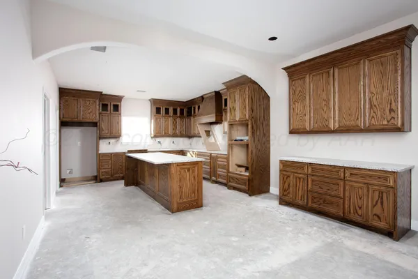 a large kitchen with a large window