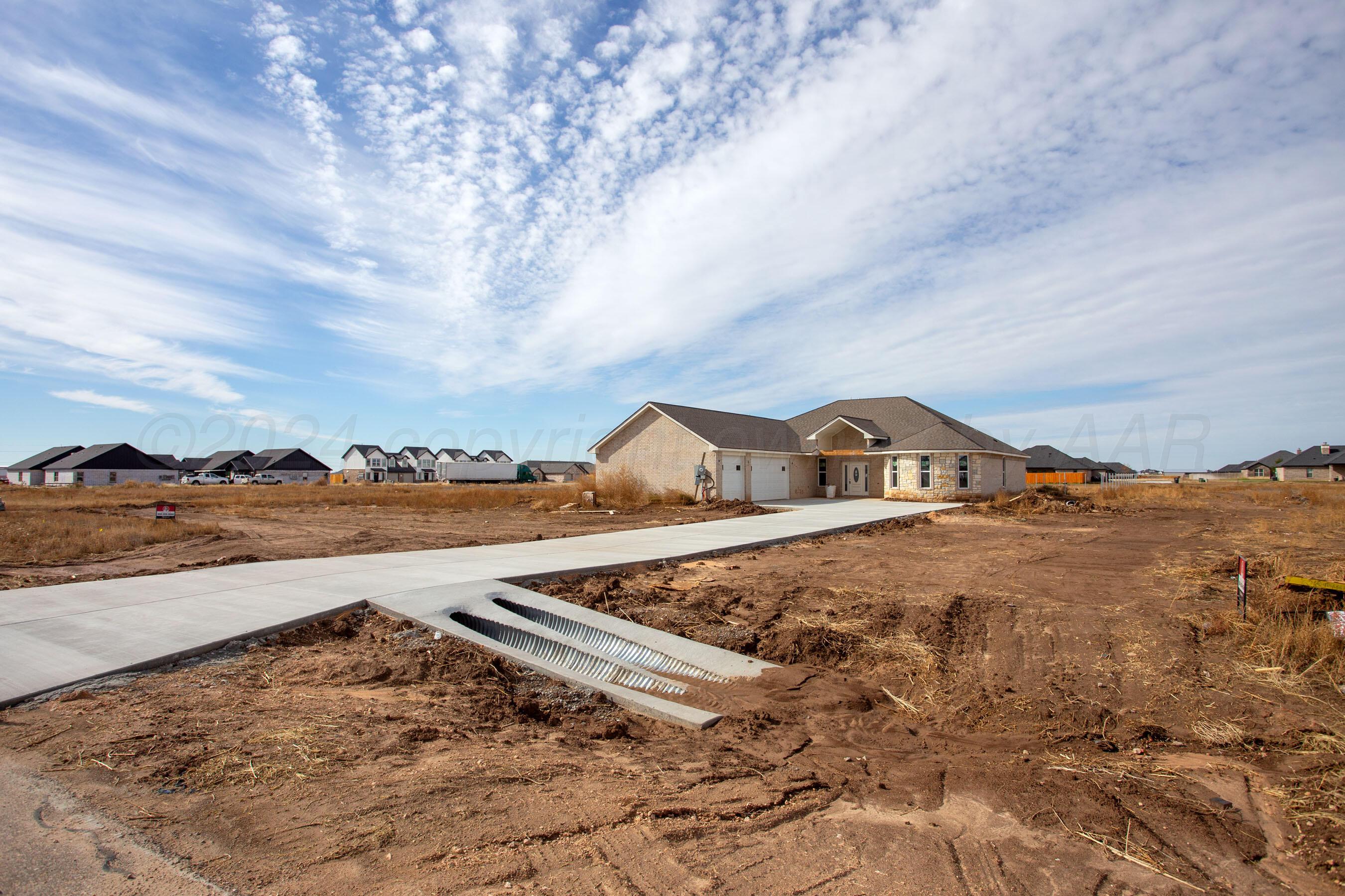 14540 Periwinkle Drive Amarillo, TX 79119 - Photo 24 of 24 a view of a town with mountains in the background