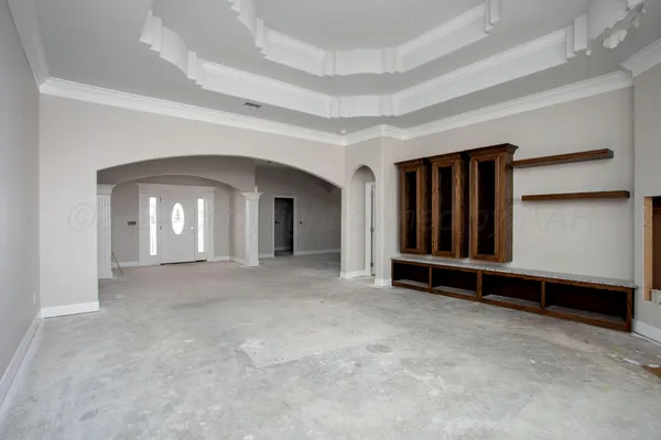 a view of an empty room with a fireplace