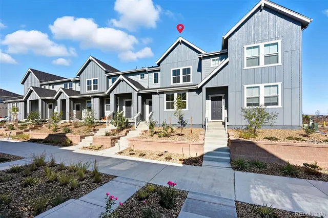 a front view of a house with swimming pool and porch