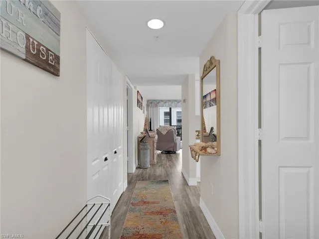 a view of a living room and a hallway