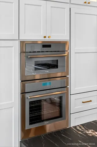 a view of a hallway with wooden door