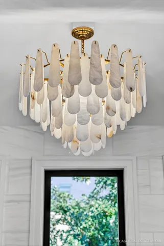 a large kitchen with kitchen island a large counter top space a sink stainless steel appliances and cabinets