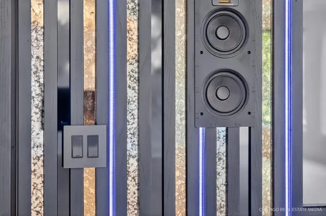 a kitchen with stainless steel appliances a stove and white cabinets