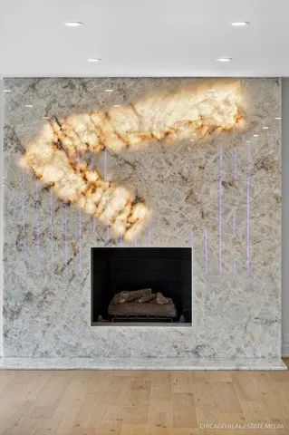 a view of a kitchen with a sink and refrigerator