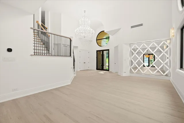 a bathroom with a shower and a glass door