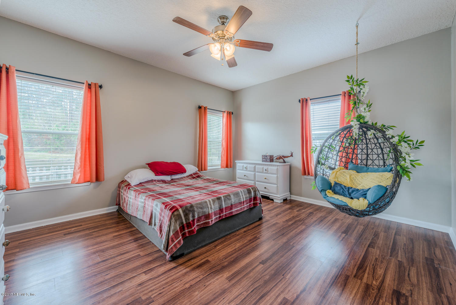 9170 Raptor Drive Jacksonville, FL 32221 - Photo 21 of 31 a bedroom with a bed dresser and a window