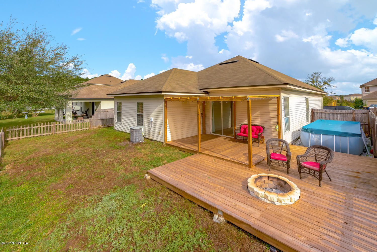 9170 Raptor Drive Jacksonville, FL 32221 - Photo 29 of 31 a view of a house with backyard and sitting area