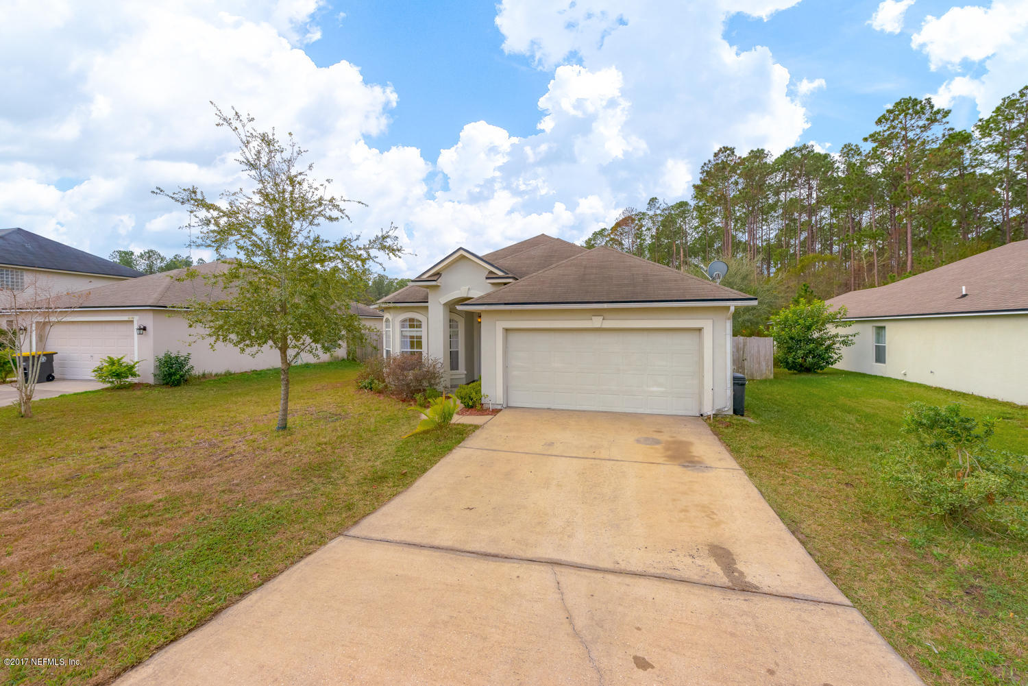9170 Raptor Drive Jacksonville, FL 32221 - Photo 3 of 31 a front view of a house with garden