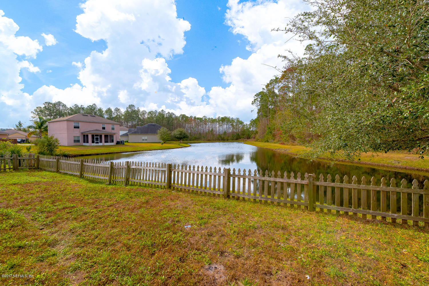9170 Raptor Drive Jacksonville, FL 32221 - Photo 31 of 31 a view of a lake with houses in city