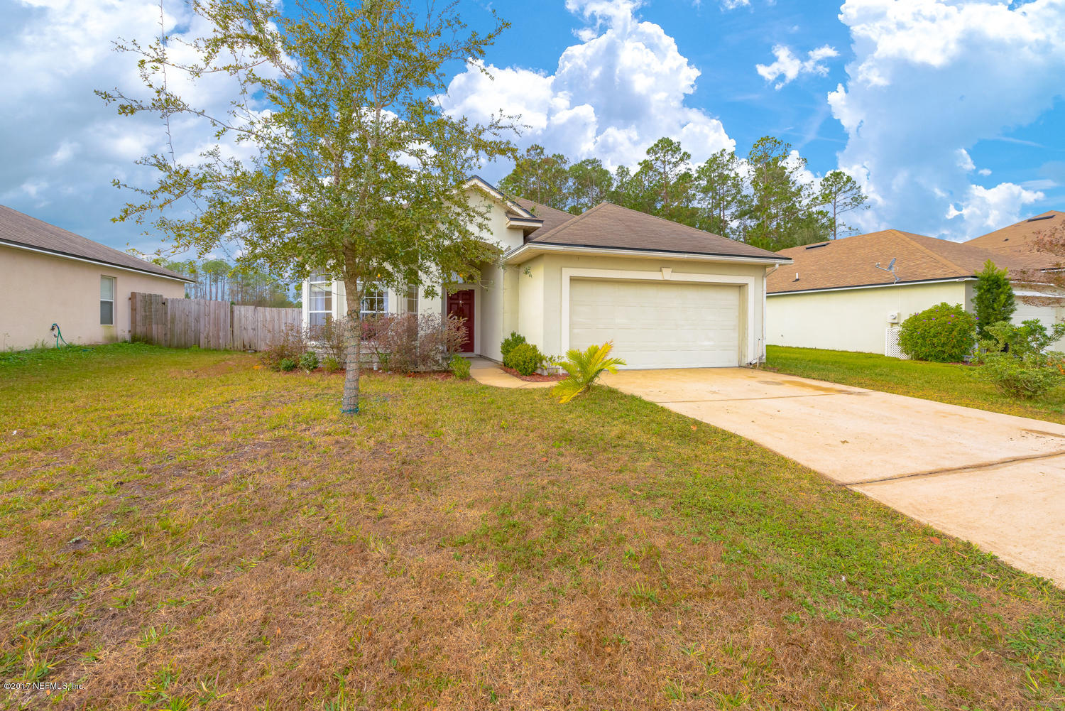 9170 Raptor Drive Jacksonville, FL 32221 - Photo 4 of 31 a front view of house with yard and trees