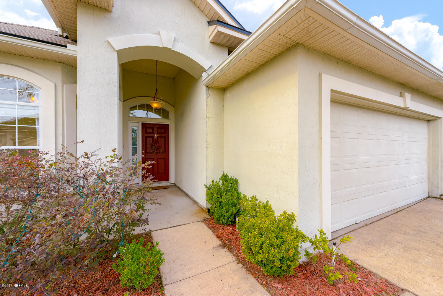9170 Raptor Drive Jacksonville, FL 32221 - Photo 5 of 31 a front view of a house with garden