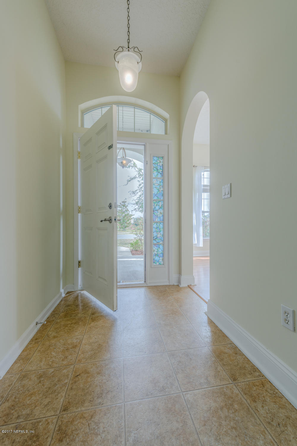 9170 Raptor Drive Jacksonville, FL 32221 - Photo 8 of 31 wooden floor in an empty room with a window
