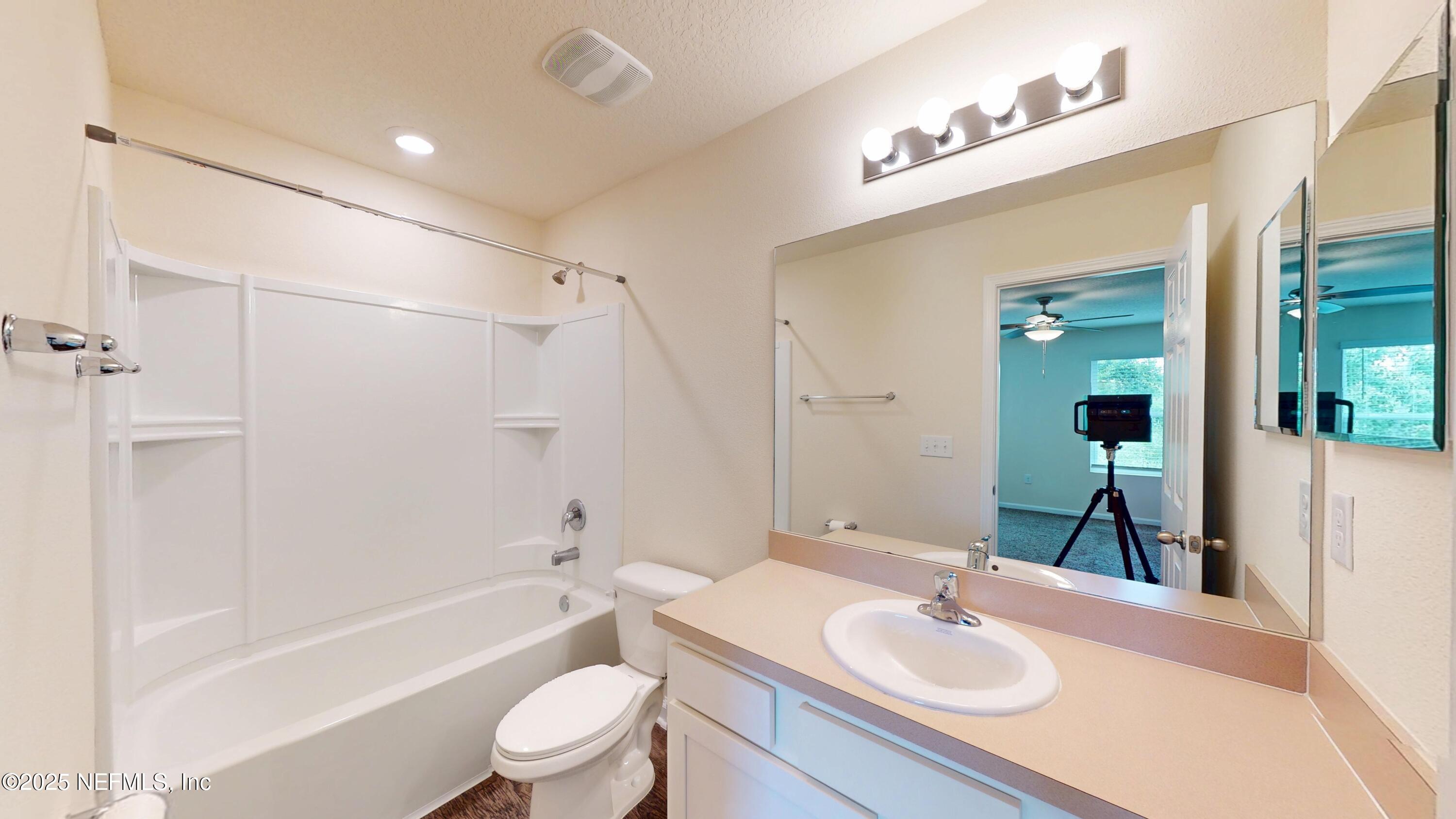 93 Scotch Pebble Drive Jacksonville, FL 32259 - Photo 12 of 27 a bathroom with a sink a toilet and shower