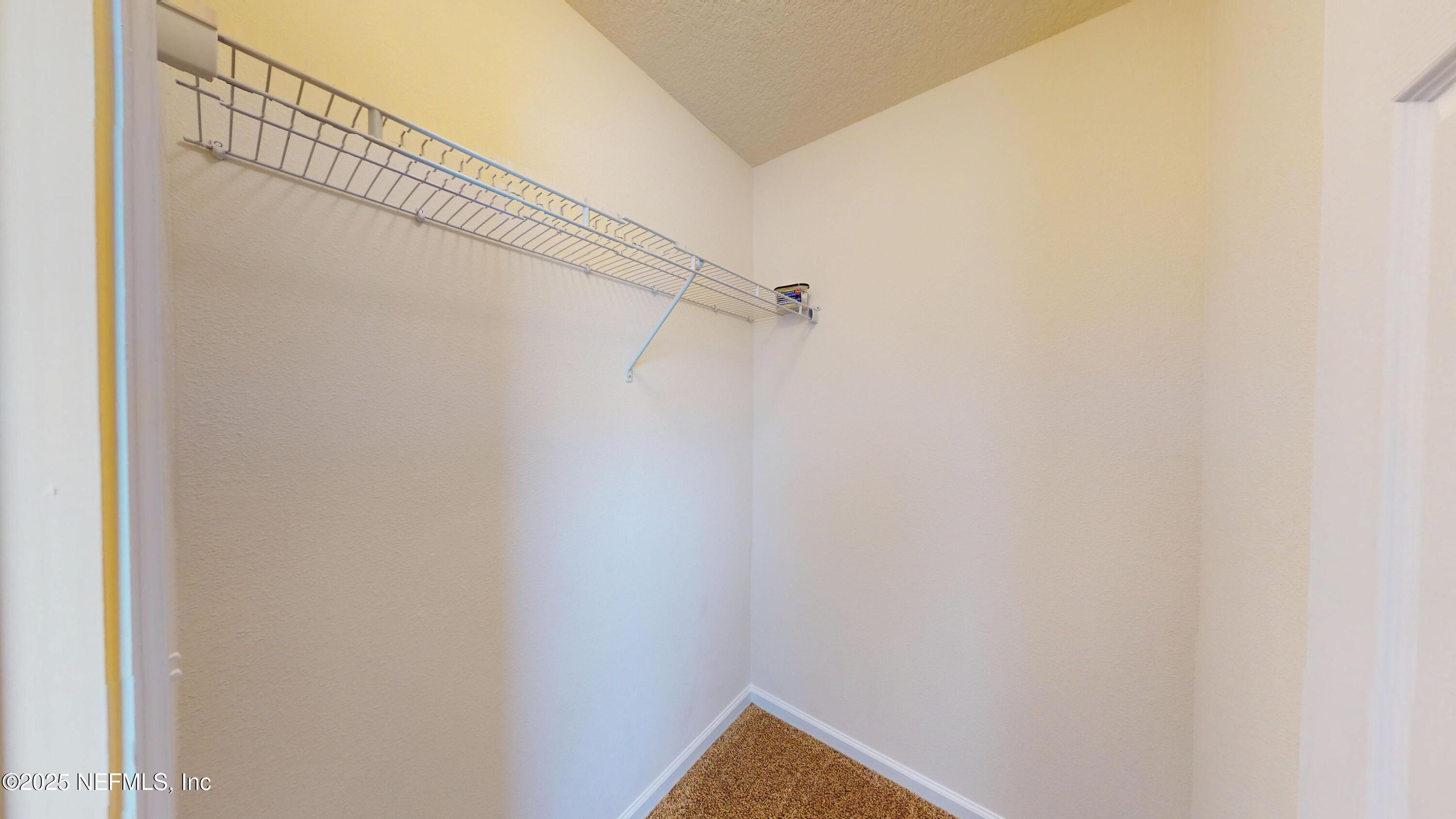 93 Scotch Pebble Drive Jacksonville, FL 32259 - Photo 15 of 27 a view of a room with racks on the wall