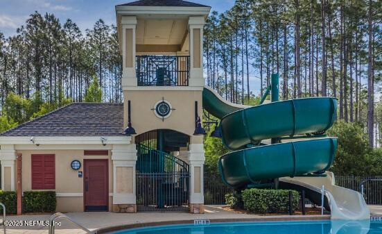 93 Scotch Pebble Drive Jacksonville, FL 32259 - Photo 22 of 27 a front view of a house with garden