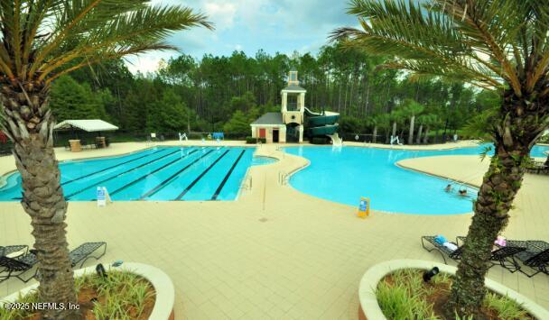 93 Scotch Pebble Drive Jacksonville, FL 32259 - Photo 23 of 27 a view of a swimming pool with a yard