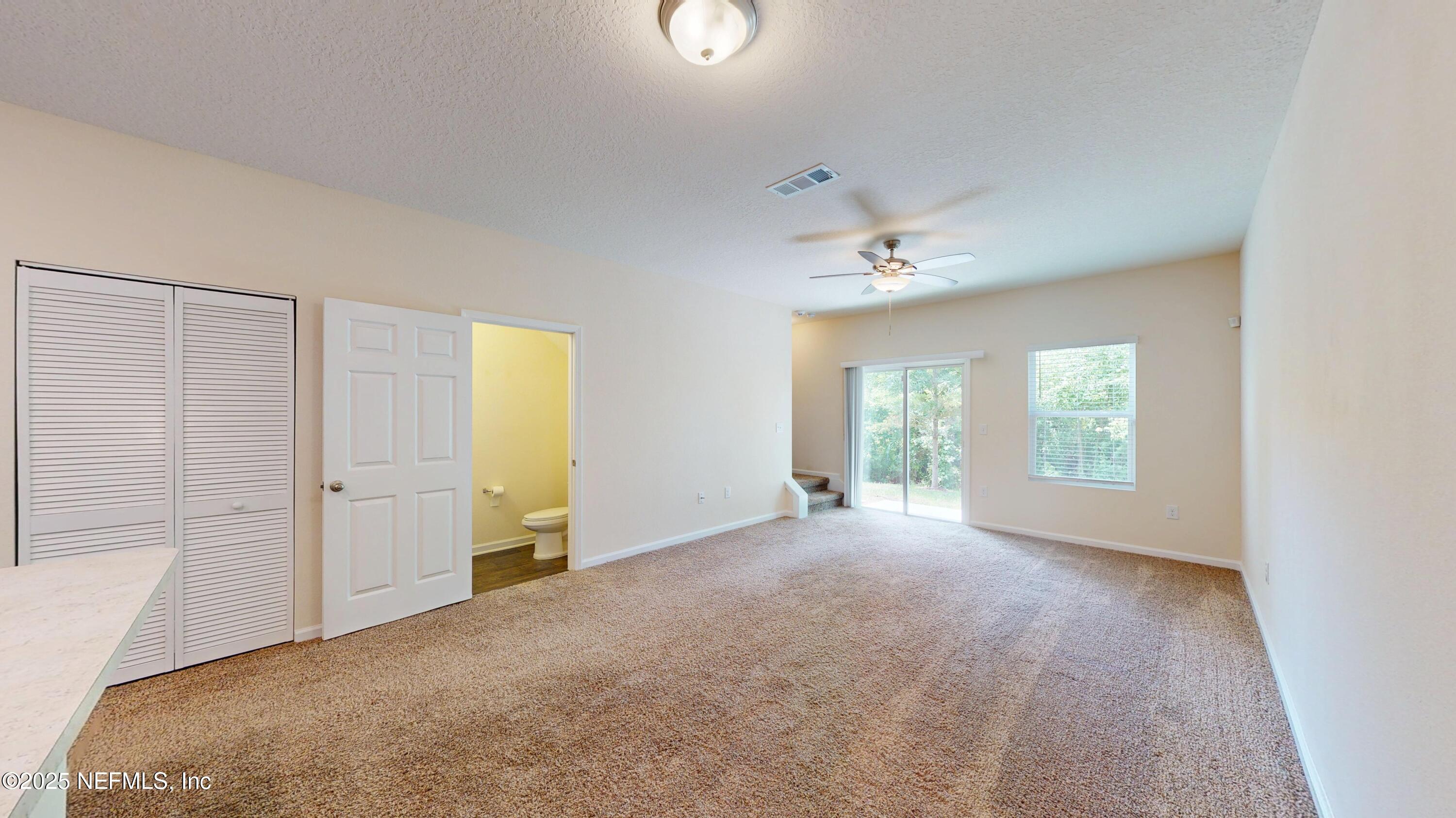 93 Scotch Pebble Drive Jacksonville, FL 32259 - Photo 7 of 27 a view of a livingroom with a ceiling fan and window