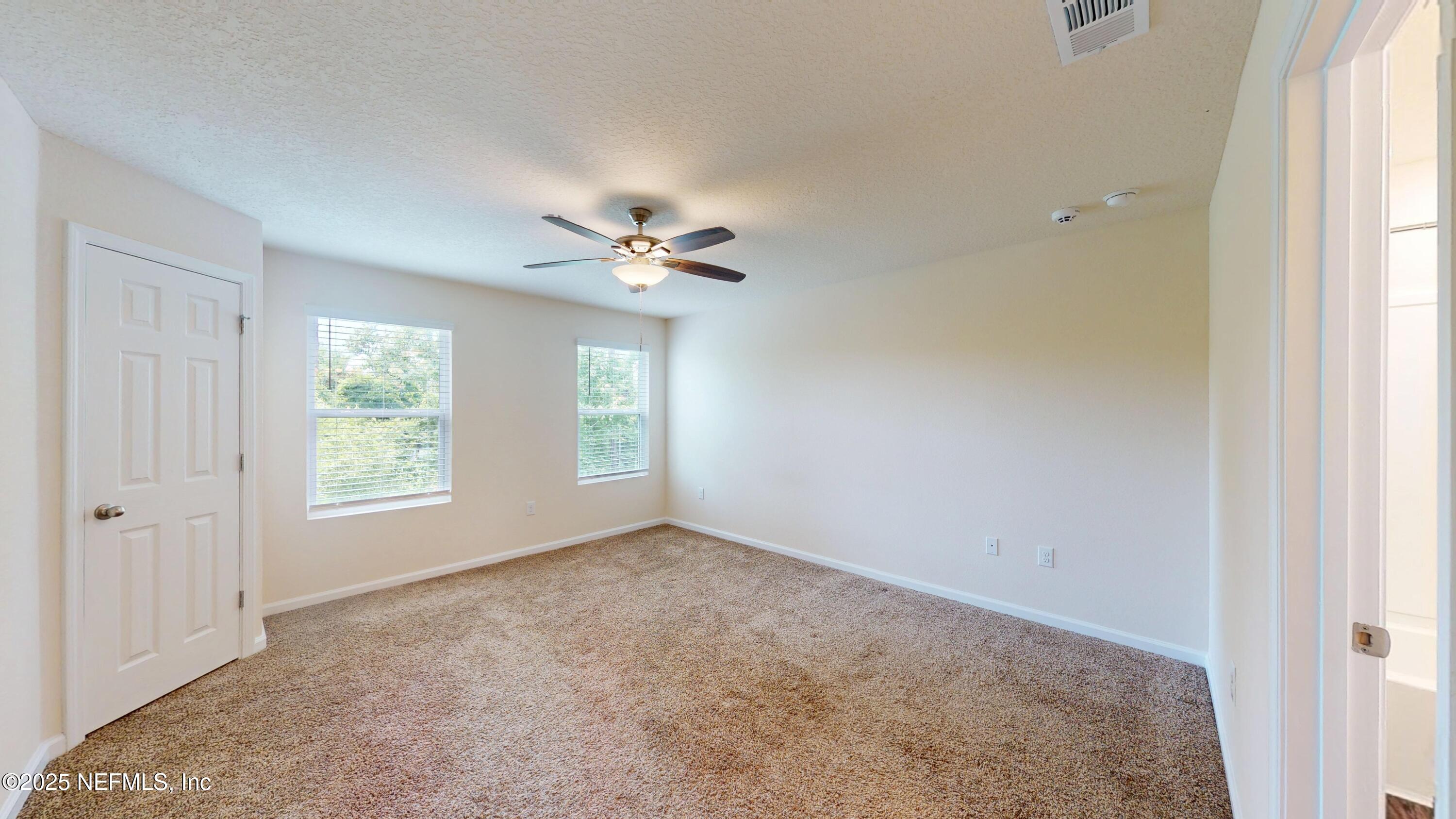93 Scotch Pebble Drive Jacksonville, FL 32259 - Photo 9 of 27 a view of an empty room with a window