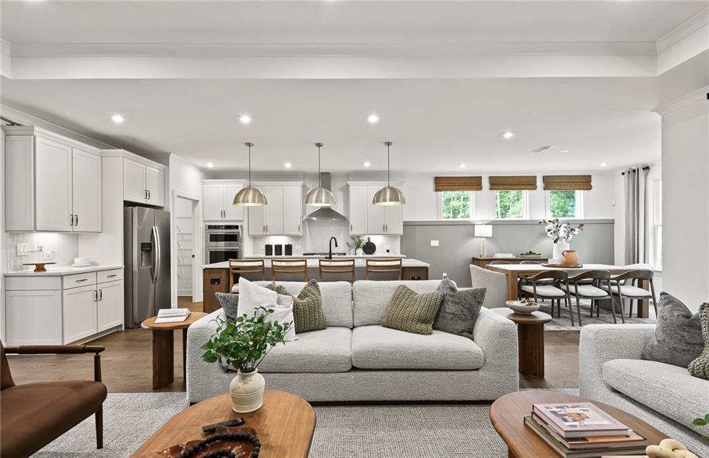 319 Canoe Place Villa Rica, GA 30180 - Photo 13 of 38 a living room with stainless steel appliances furniture and a kitchen view