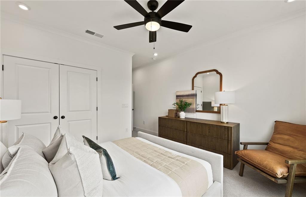 319 Canoe Place Villa Rica, GA 30180 - Photo 23 of 38 a bedroom with a bed and a couch