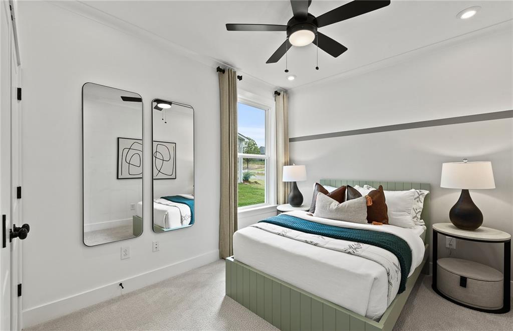 319 Canoe Place Villa Rica, GA 30180 - Photo 33 of 38 a bedroom with a bed and a chandelier