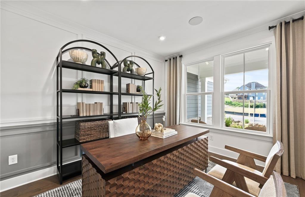 319 Canoe Place Villa Rica, GA 30180 - Photo 7 of 38 a living room with furniture a window and wooden floor