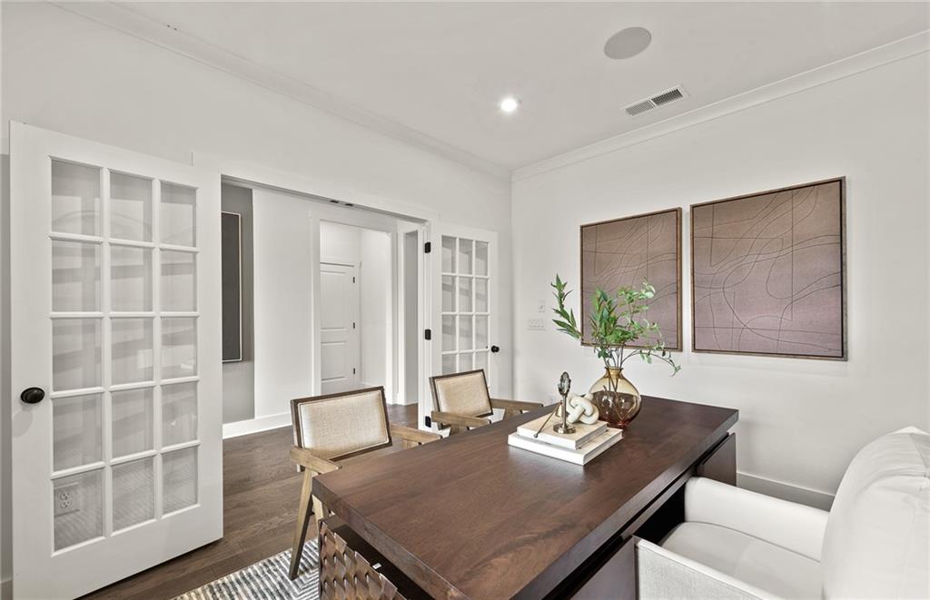 319 Canoe Place Villa Rica, GA 30180 - Photo 9 of 38 a view of a dining room with furniture window and wooden floor