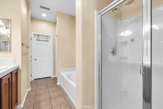 a bathroom with a glass shower door