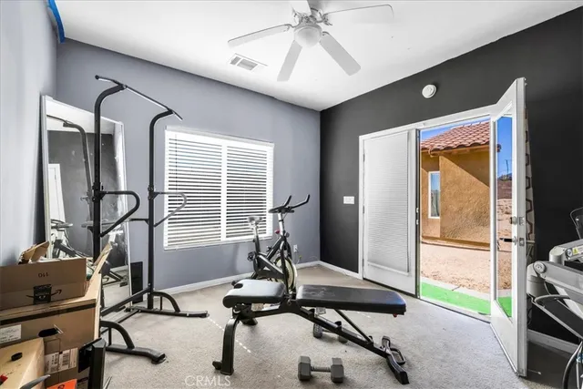 a view of a livingroom with gym equipment