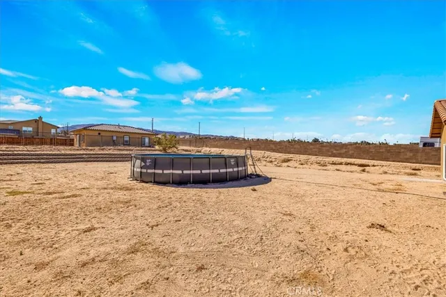 a view of a swimming pool with an outdoor seating