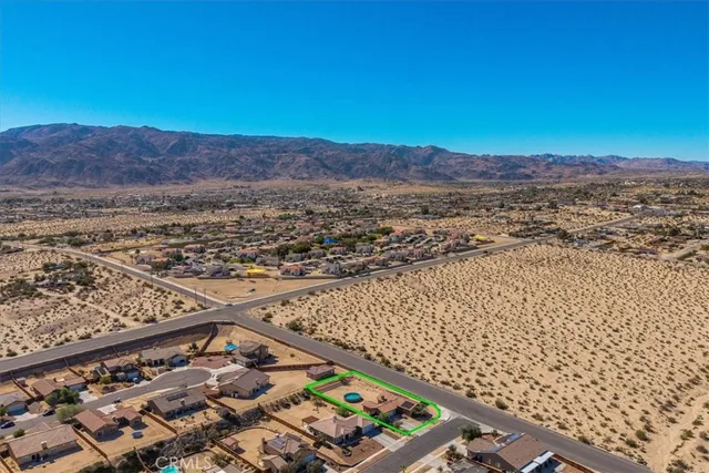 an aerial view of residential building and ocean view