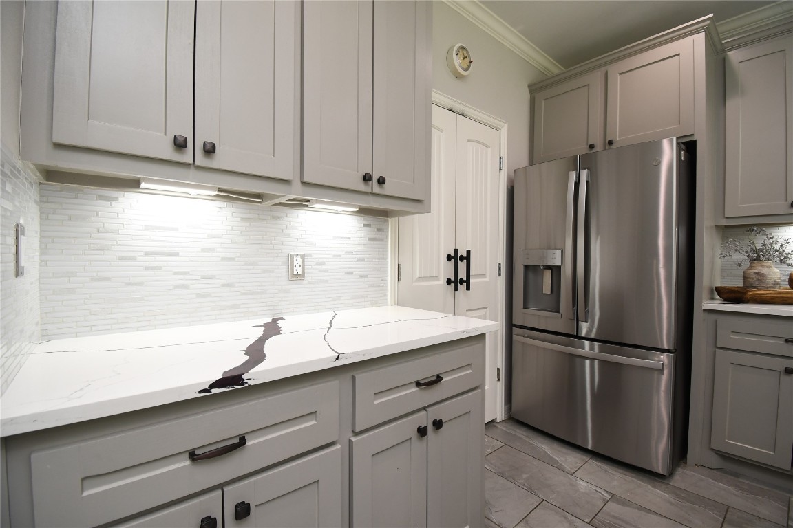 2406 Hummingbird Street New Caney, TX 77357 - Photo 13 of 40 a kitchen with appliances a counter space and a window