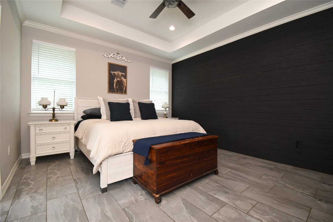 2406 Hummingbird Street New Caney, TX 77357 - Photo 17 of 40 a bedroom with a bed and window