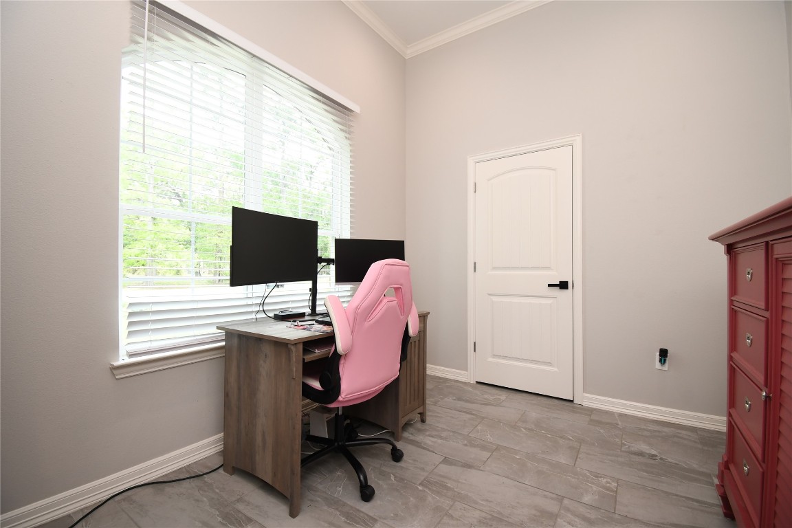 2406 Hummingbird Street New Caney, TX 77357 - Photo 30 of 40 a view of a workspace with a window