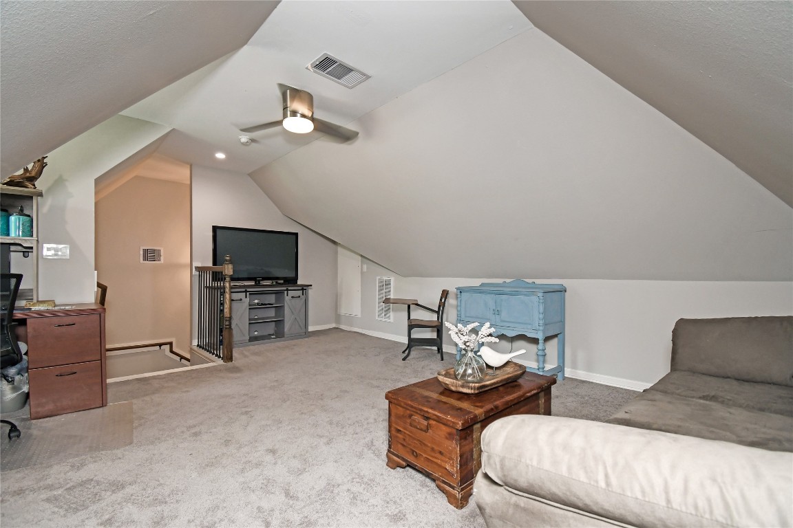 2406 Hummingbird Street New Caney, TX 77357 - Photo 32 of 40 a bedroom with furniture and a flat screen tv