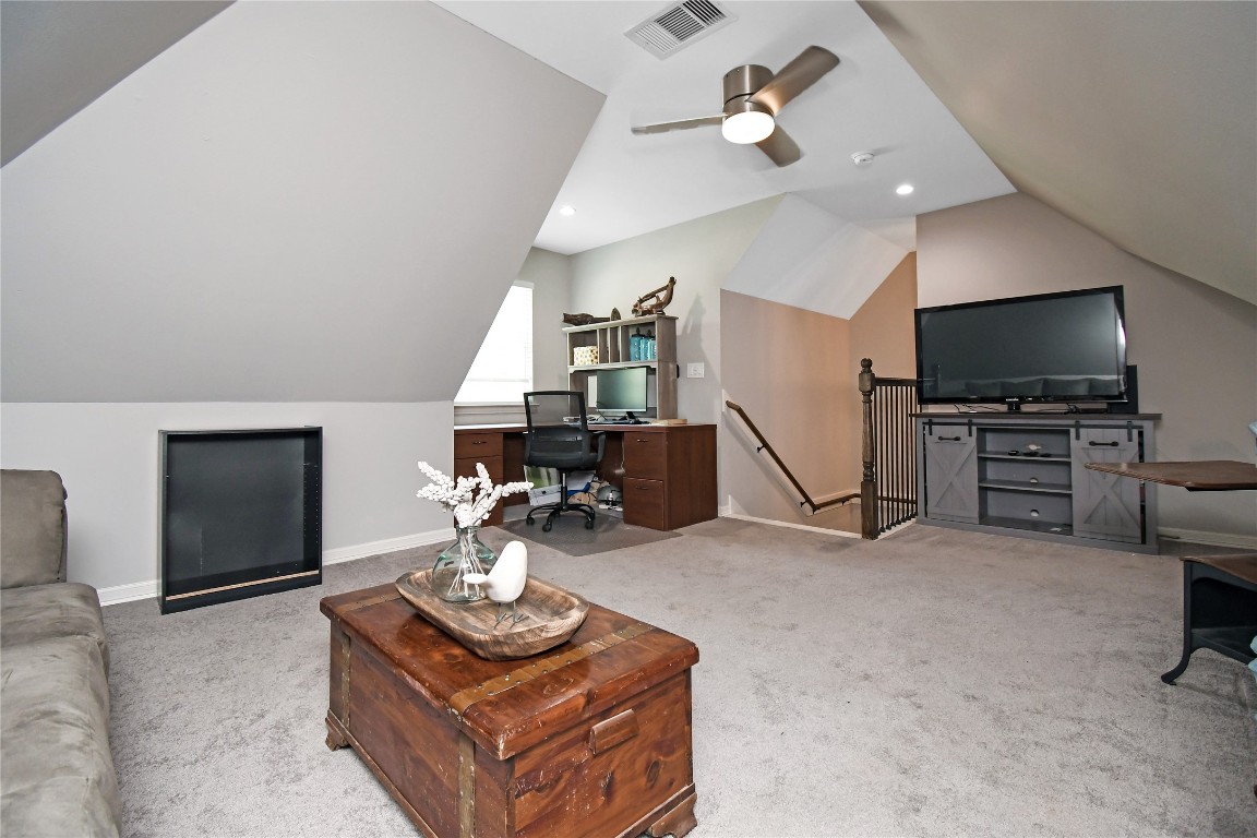2406 Hummingbird Street New Caney, TX 77357 - Photo 33 of 40 a living room with furniture and a flat screen tv
