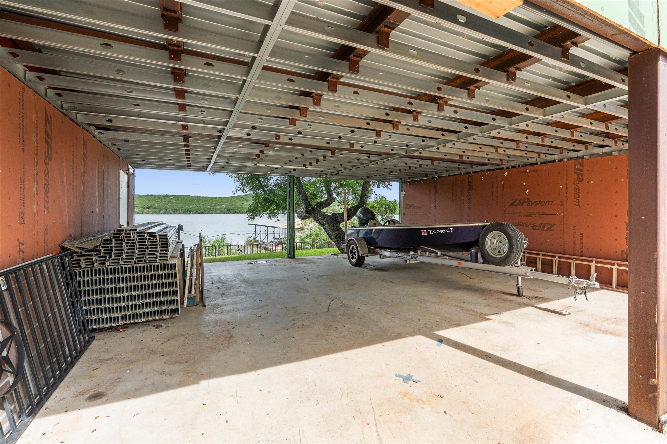 325 Eagle Rest Burnet, TX 78611 - Photo 30 of 40 A spacious covered parking area provides ample boat storage with serene waterfront views.