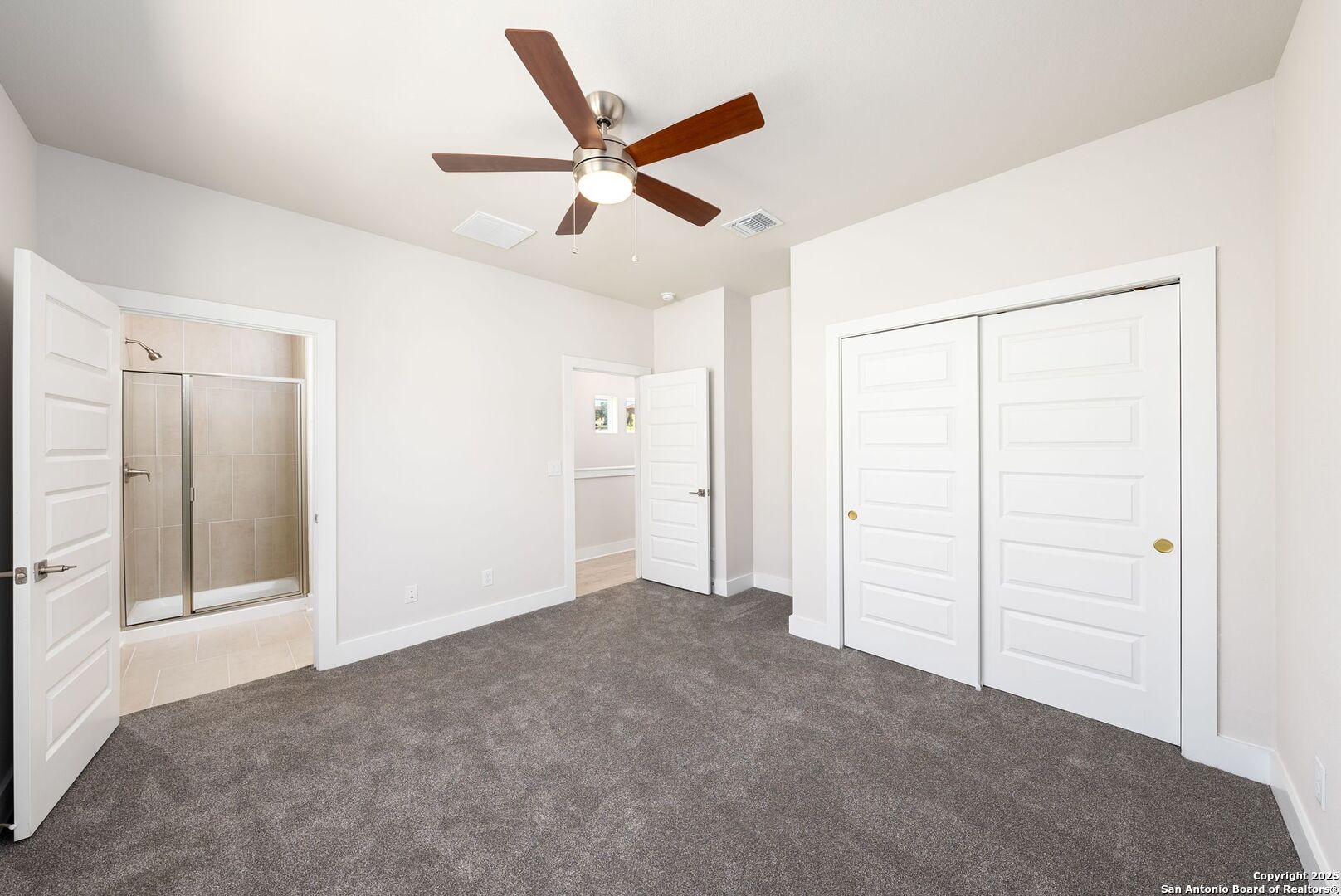 419 Ira Avenue, Unit 1102 San Antonio, TX 78209 - Photo 16 of 28 a view of a livingroom with a ceiling fan & entryway