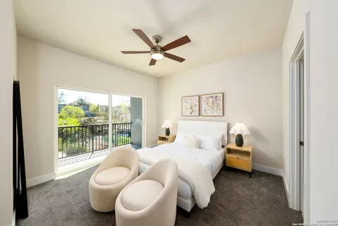 a bedroom with a bed and glass window