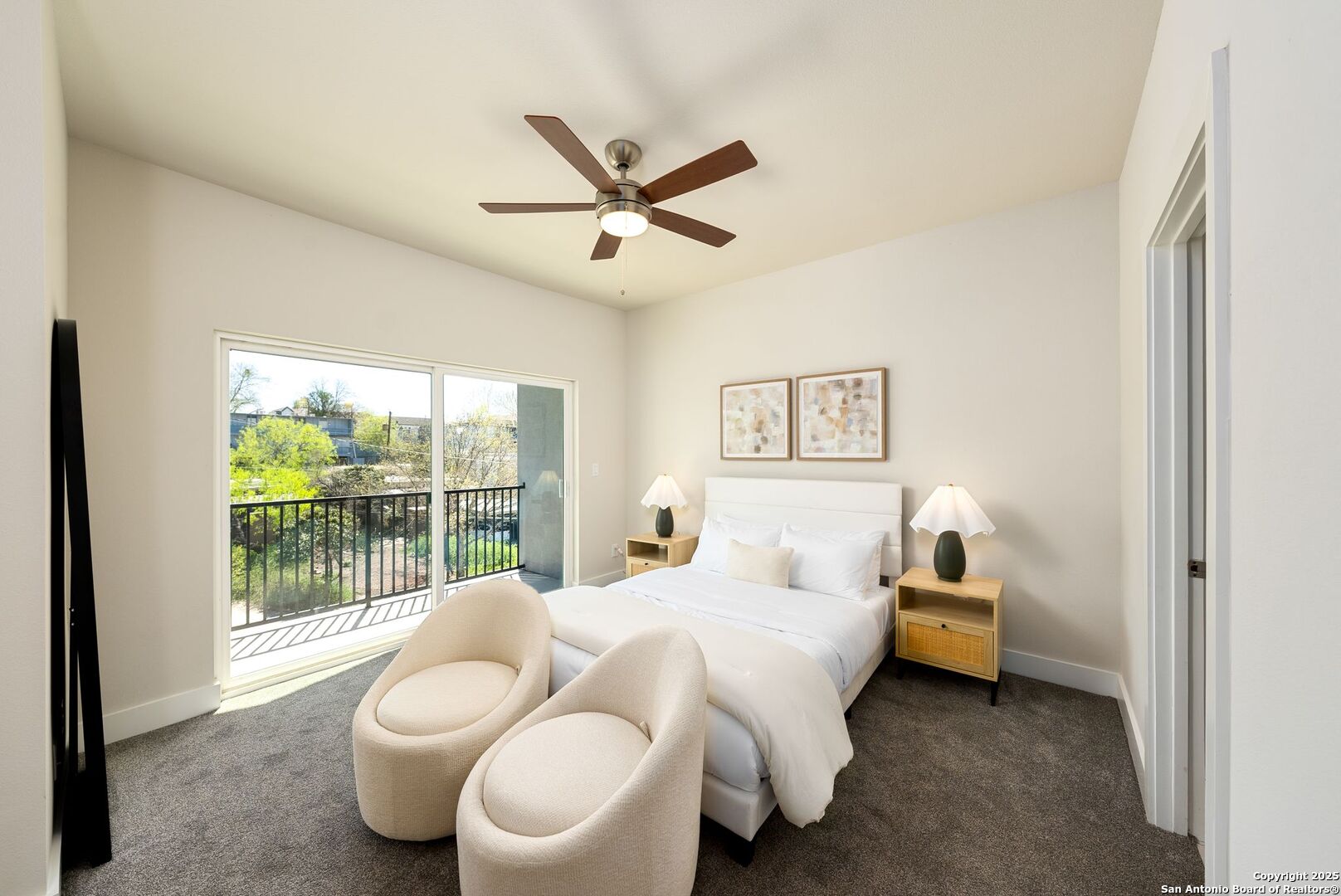 419 Ira Avenue, Unit 1102 San Antonio, TX 78209 - Photo 18 of 28 a bedroom with a bed and glass window