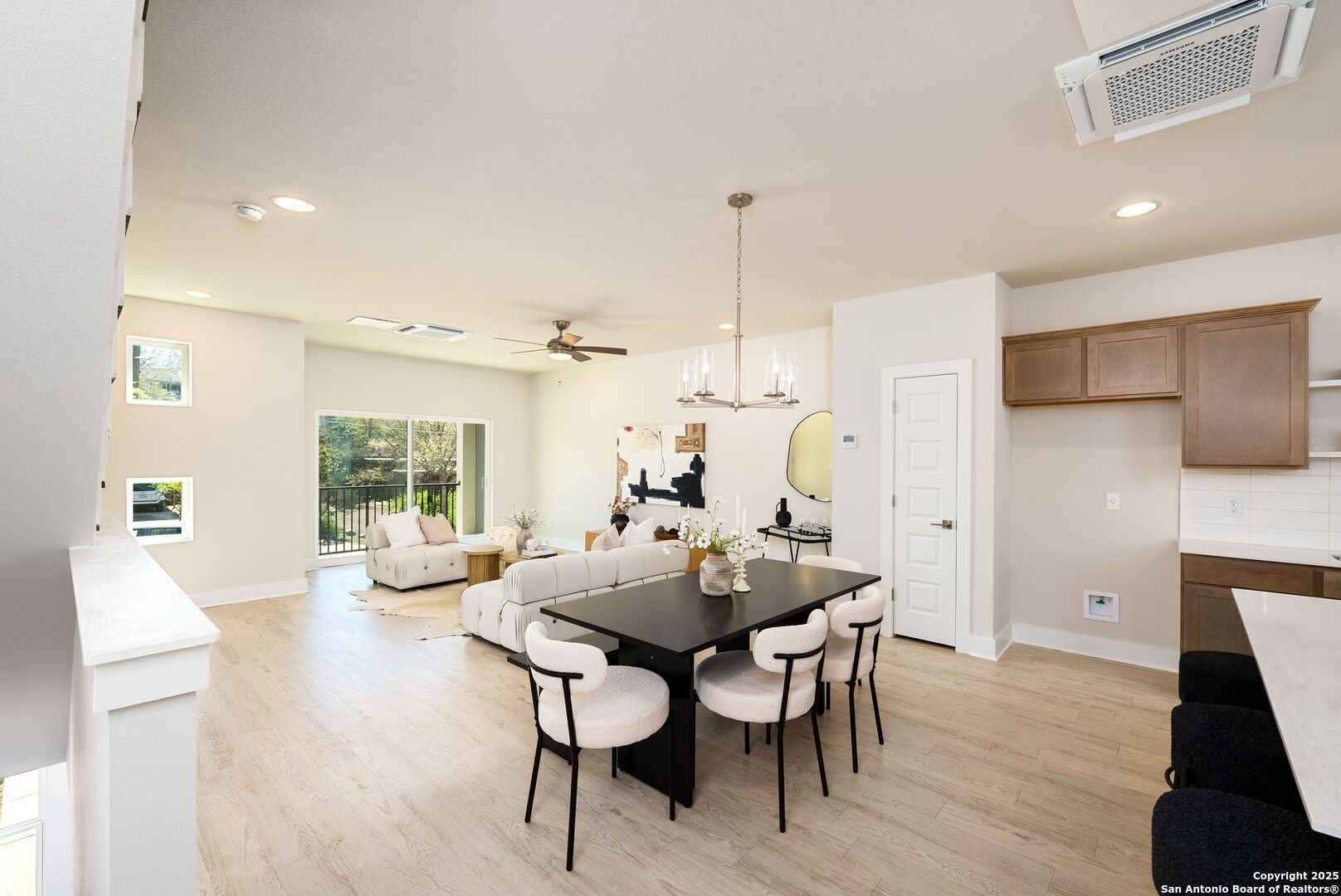 419 Ira Avenue, Unit 1102 San Antonio, TX 78209 - Photo 8 of 28 a view of a dining room with furniture window and wooden floor