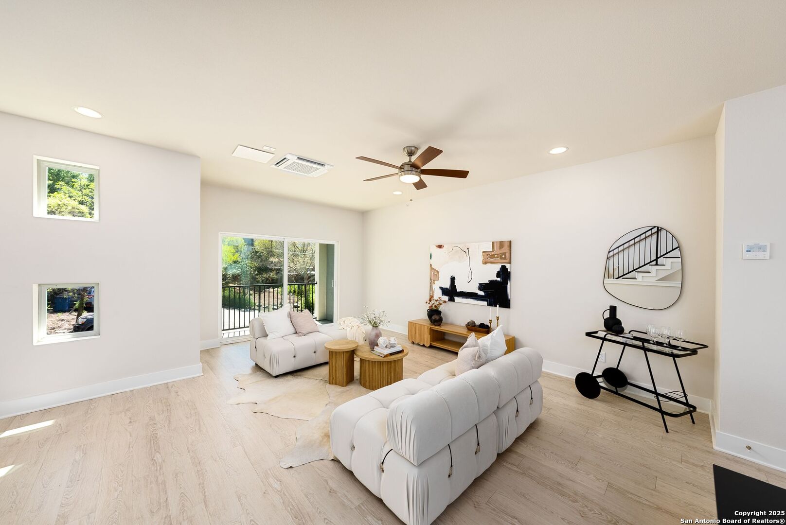 419 Ira Avenue, Unit 1102 San Antonio, TX 78209 - Photo 9 of 28 a living room with furniture and a large window