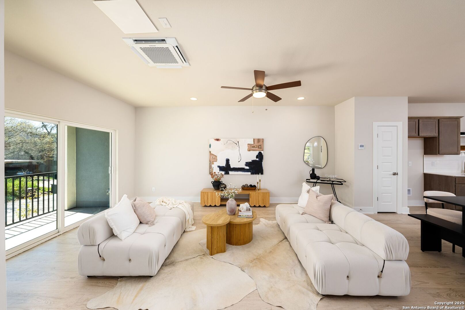 419 Ira Avenue, Unit 1102 San Antonio, TX 78209 - Photo 10 of 28 a living room with furniture and a chandelier