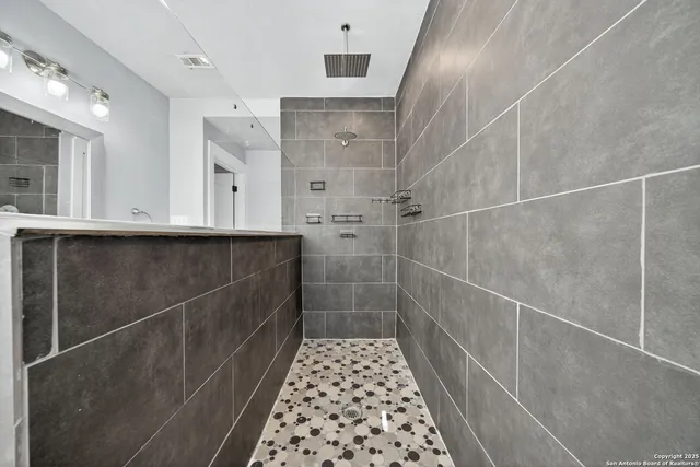 a bathroom with a sink and a shower