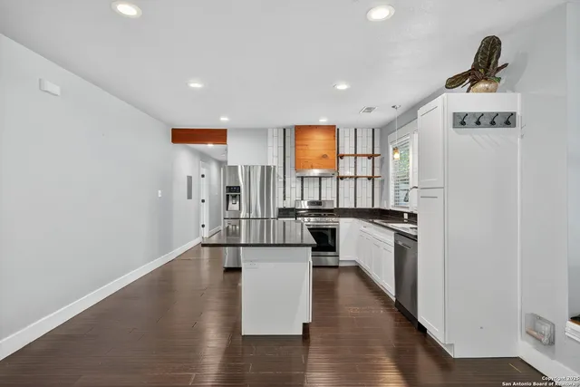 a view of a kitchen with a sink