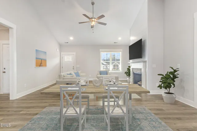 a kitchen with stainless steel appliances kitchen island granite countertop a refrigerator and a stove top oven